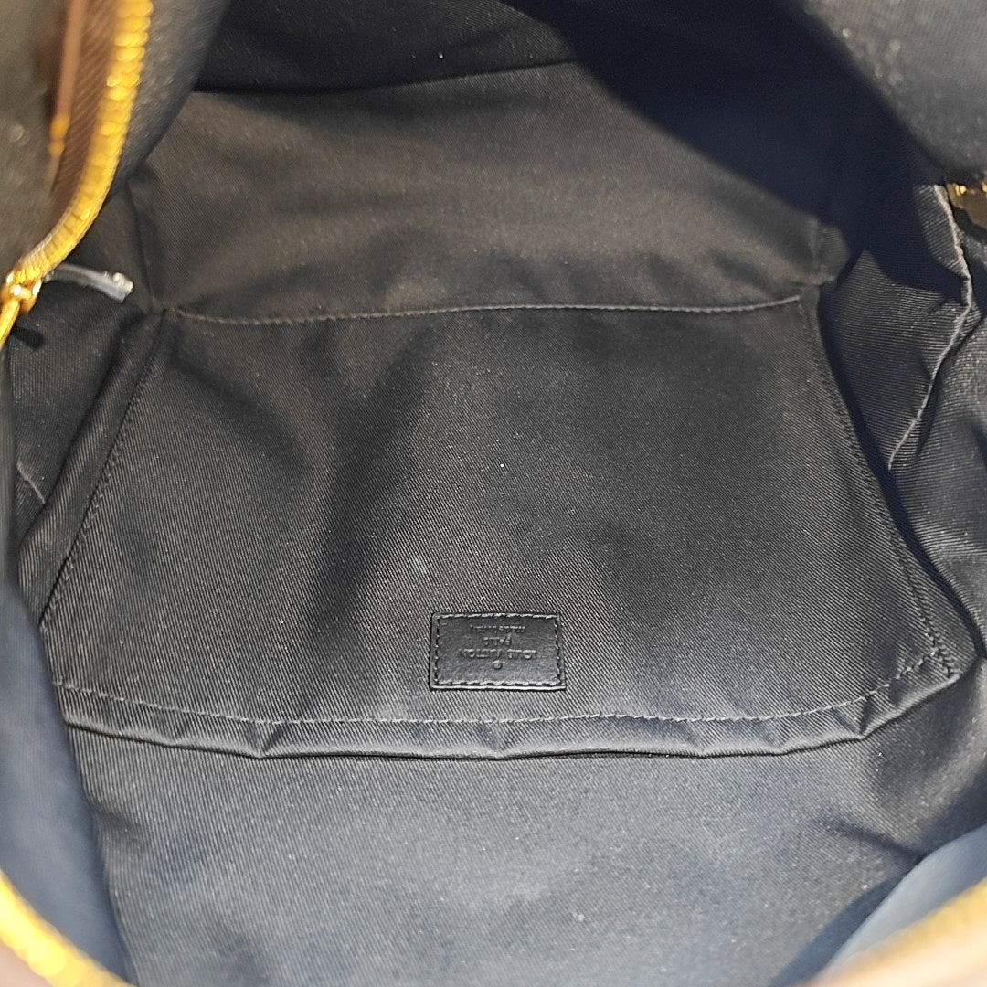Monogram Coated Canvas Backpack Brown