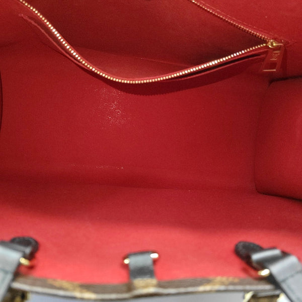 ONTHEGO MM Monogram Coated Canvas Brown
