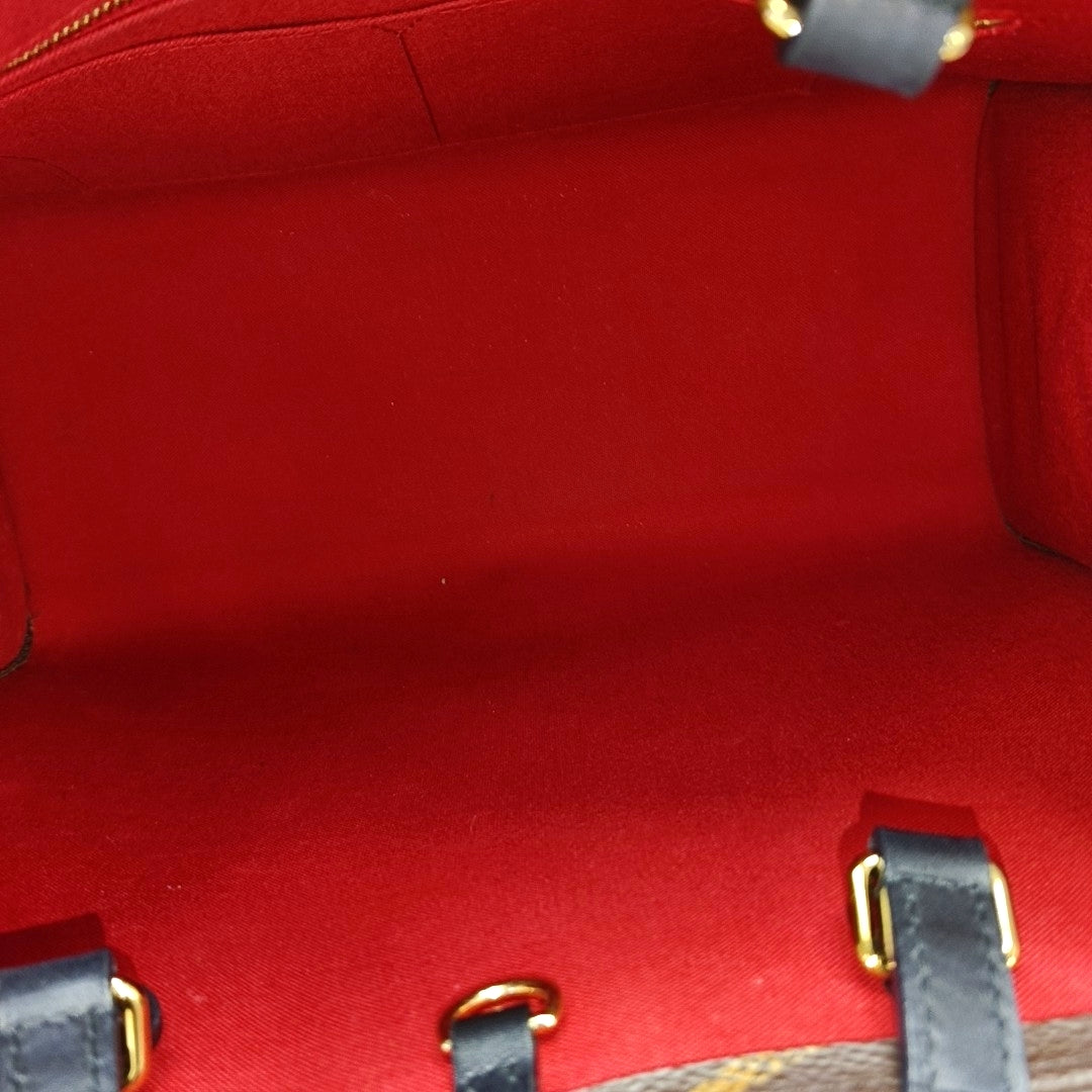 ONTHEGO MM Monogram Coated Canvas Brown