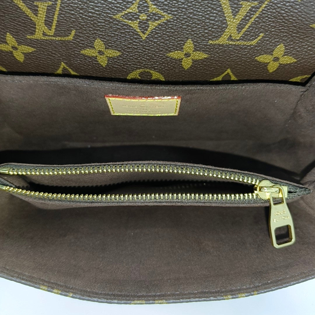 MÉTIS EAST WEST Monogram Coated Canvas Brown