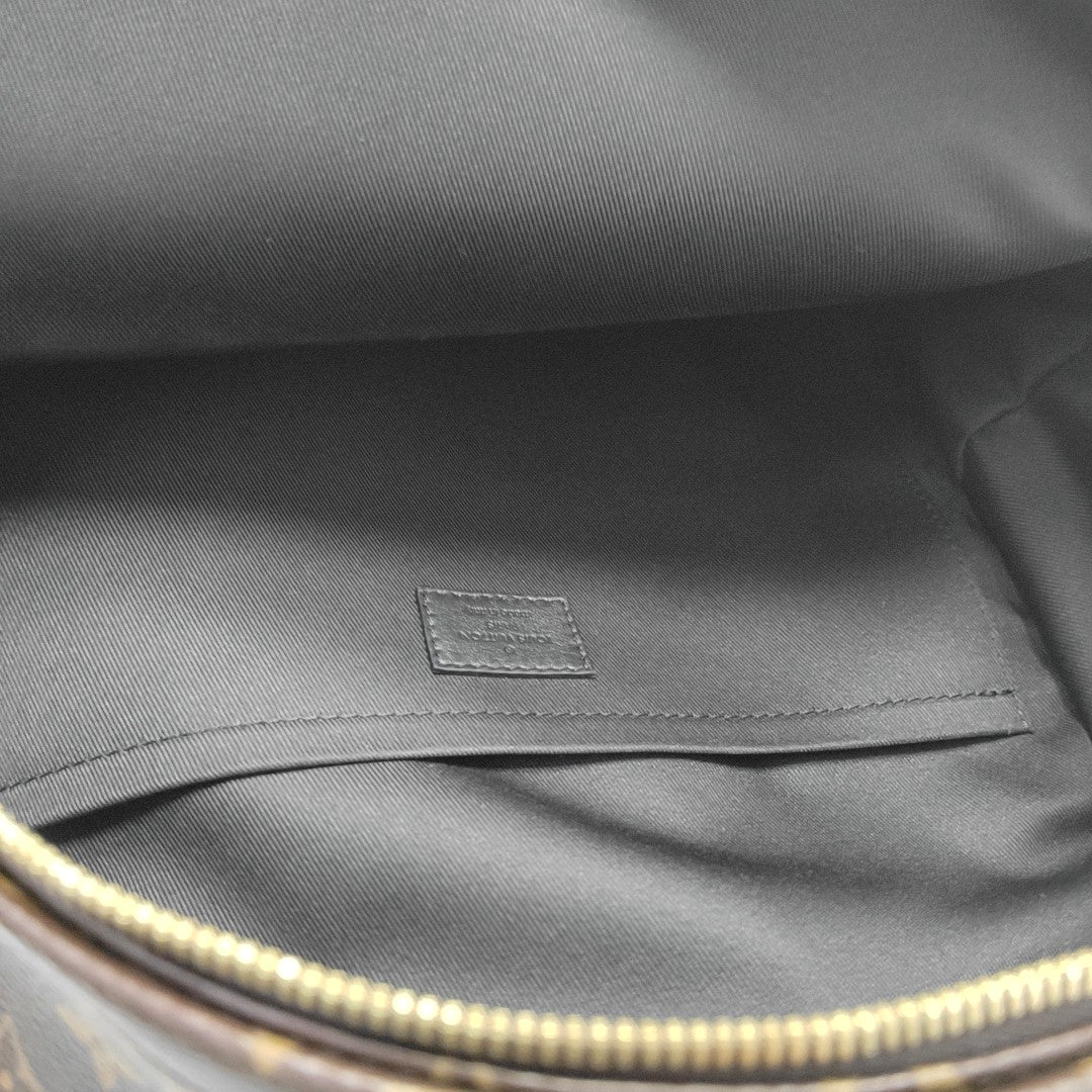 Monogram Coated Canvas Backpack Brown