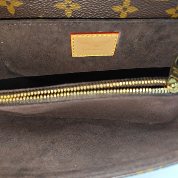 MÉTIS EAST WEST Monogram Coated Canvas Brown