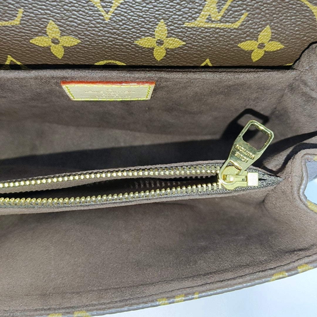 MÉTIS EAST WEST Monogram Coated Canvas Brown