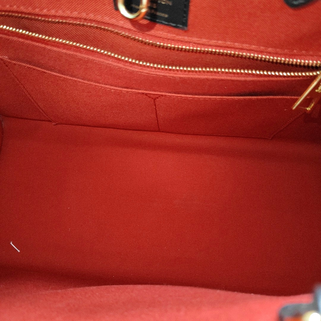 ONTHEGO MM Monogram Coated Canvas Brown