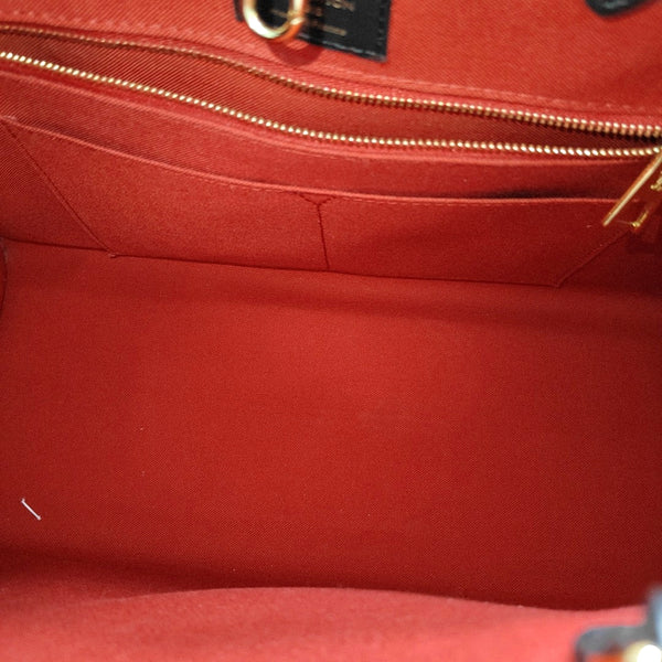 ONTHEGO MM Monogram Coated Canvas Brown