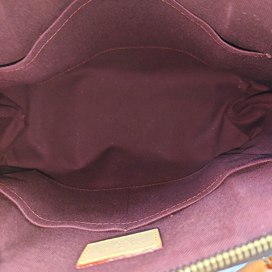 RIVOLI MM Monogram Coated Canvas Brown