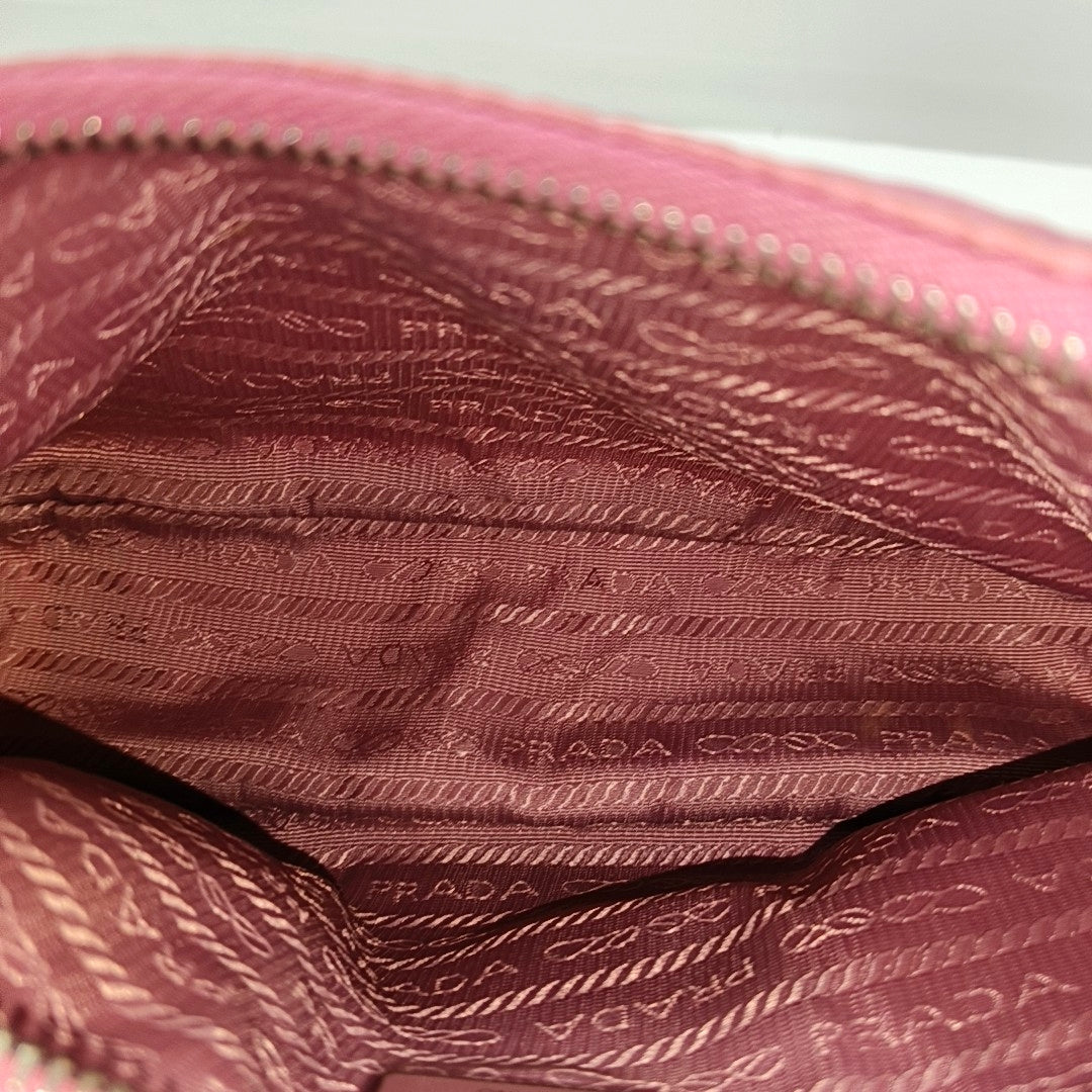 Authenticated pre-owned  Re-Edition2005 Mini Nylon Pink - Top Handle Bag at Looply