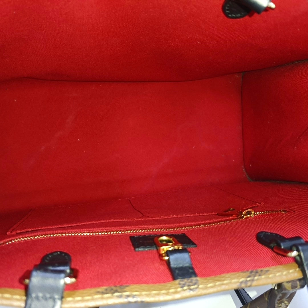 ONTHEGO MM Monogram Coated Canvas Brown