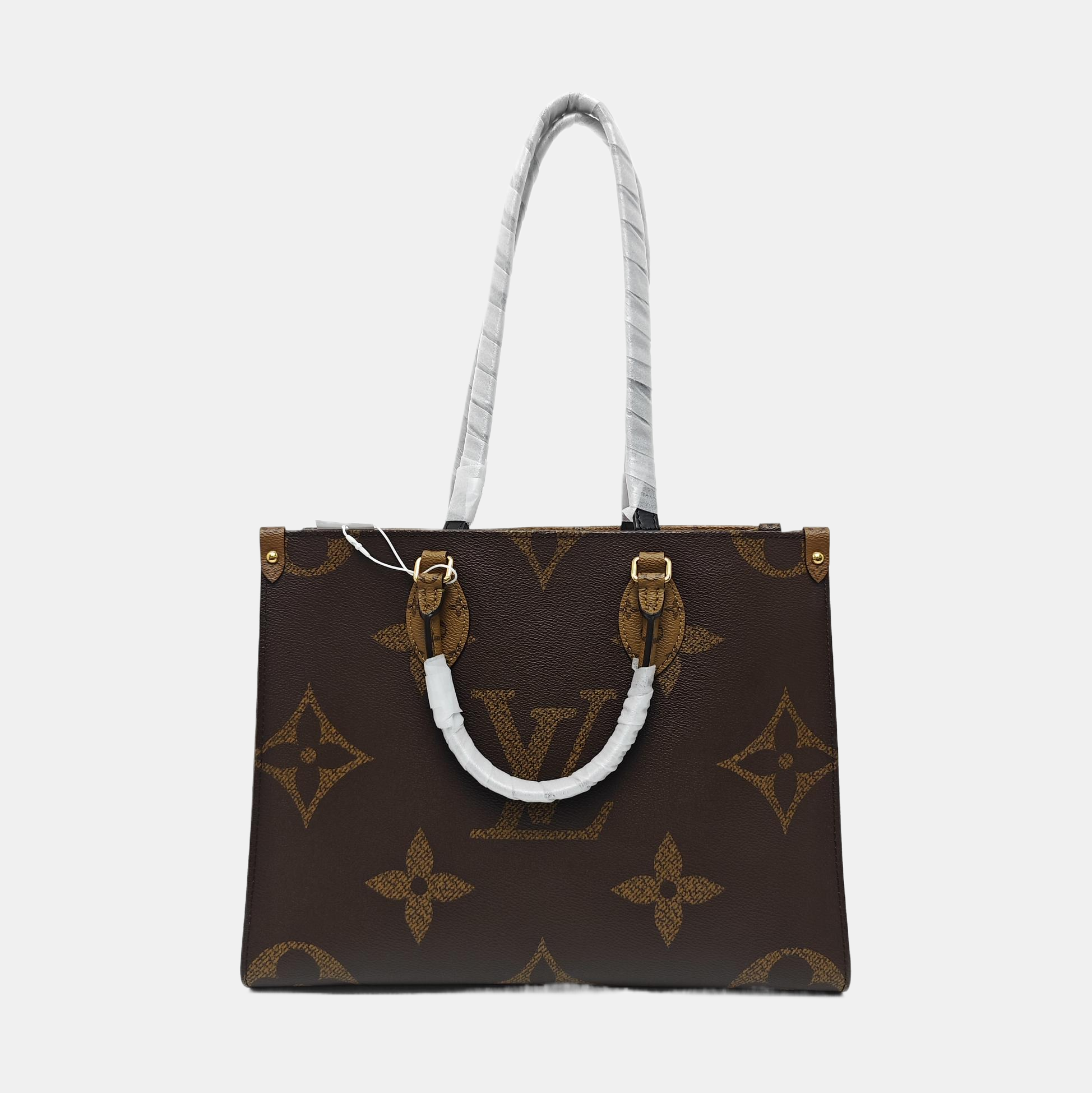 ONTHEGO MM Monogram Coated Canvas Brown