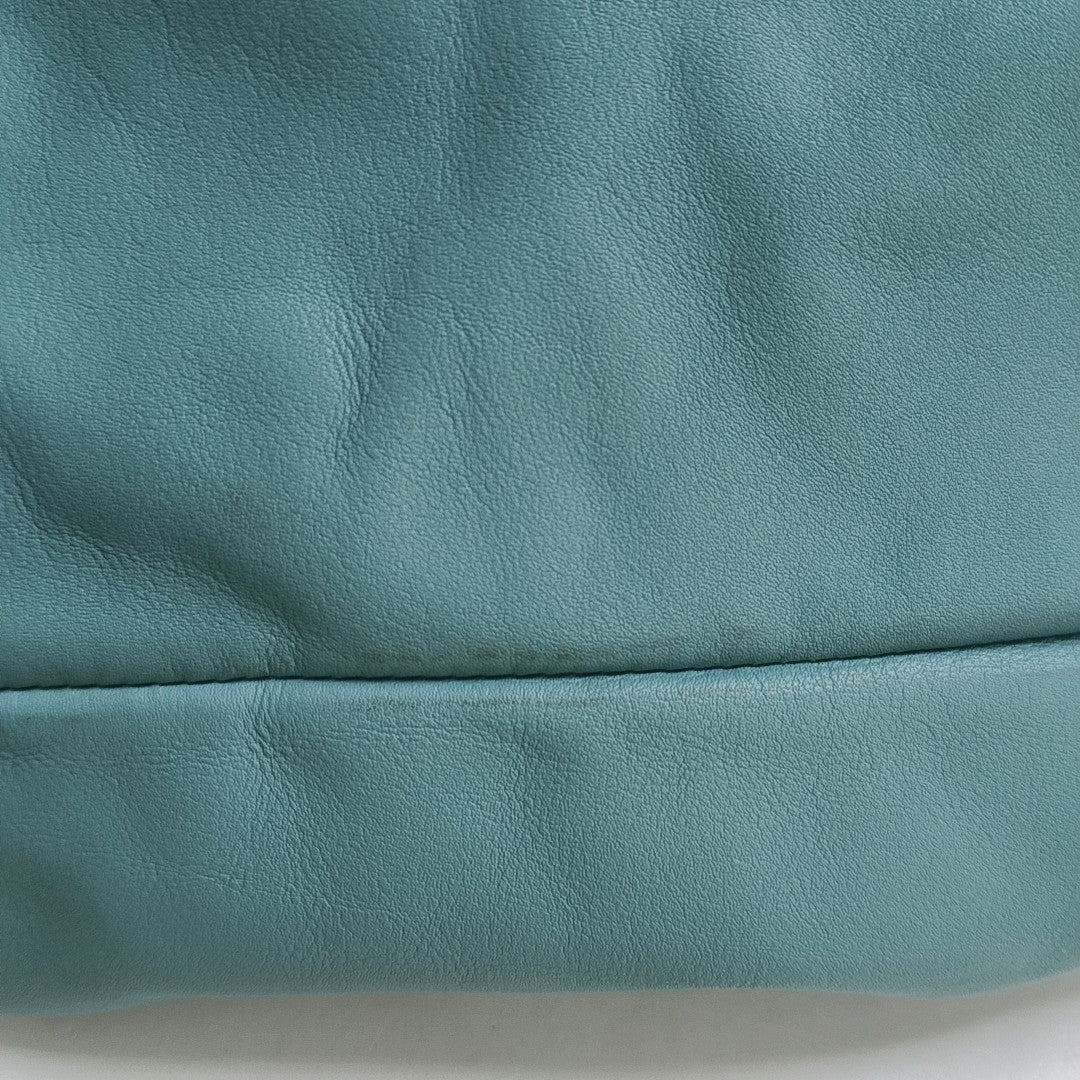 Authenticated pre-owned  The Pouch Calfskin Blue - Top Handle Bag at Looply