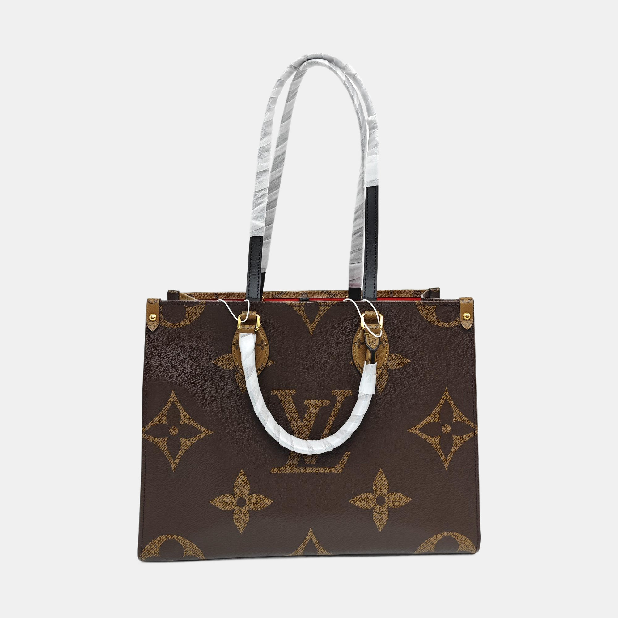 ONTHEGO MM Monogram Coated Canvas Brown