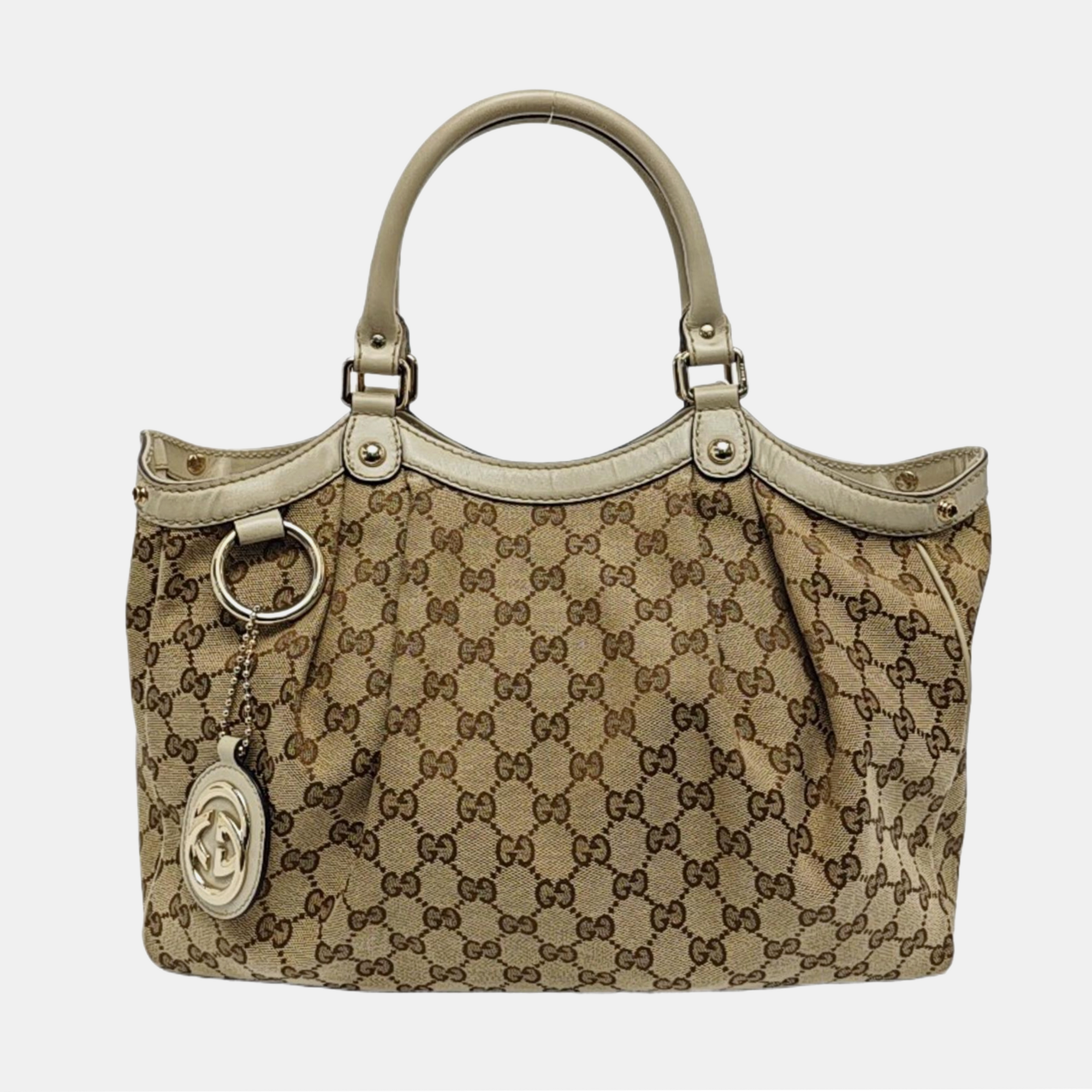 Authenticated pre-owned  Sukey Monogram Canvas Beige - Top Handle Bag at Looply