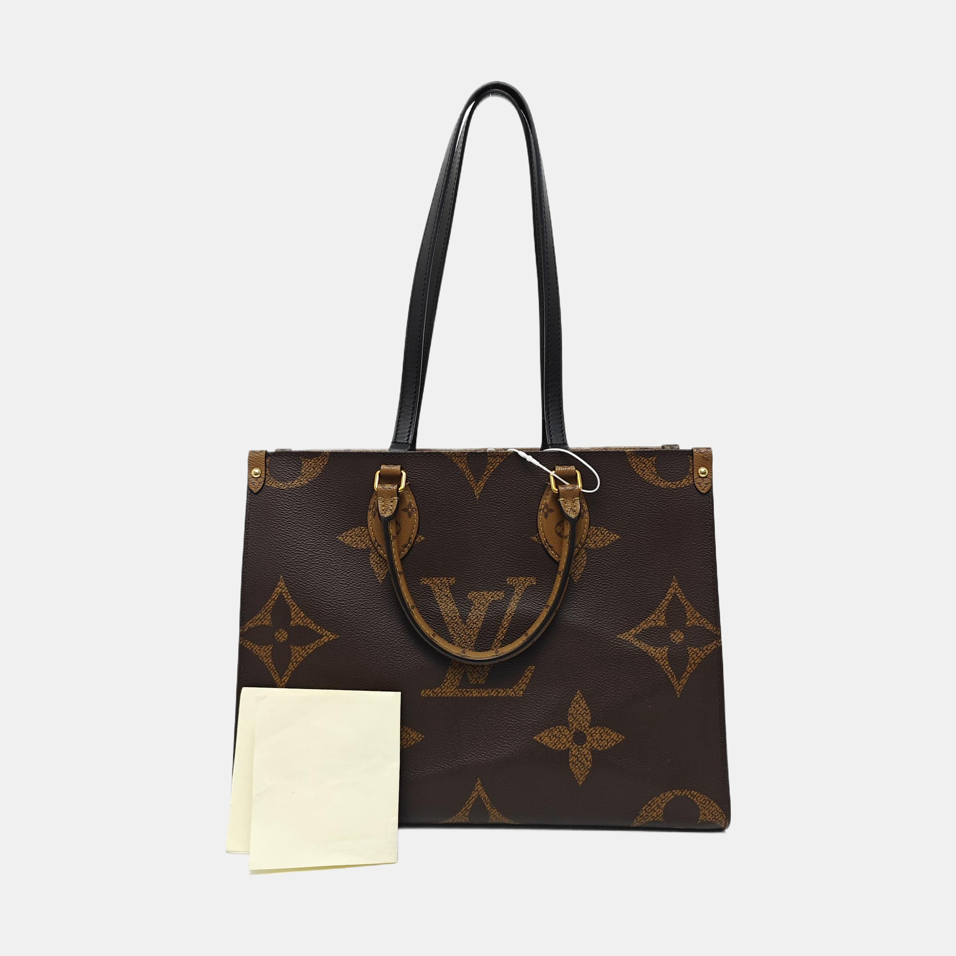 ONTHEGO MM Monogram Coated Canvas Brown