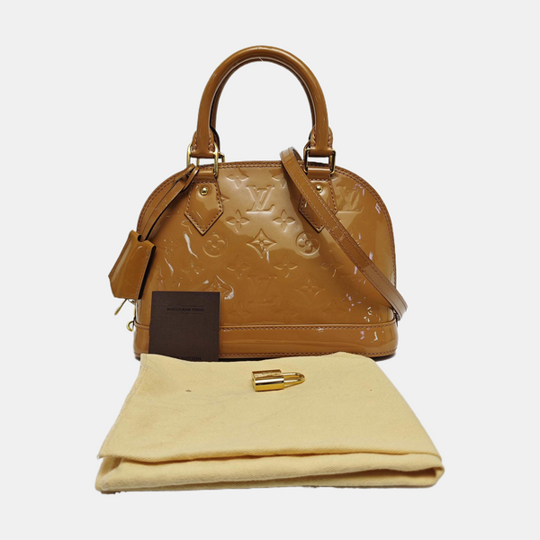 Authenticated pre-owned  ALMA Monogram Patent Leather Yellow - Shoulder Bag at Looply