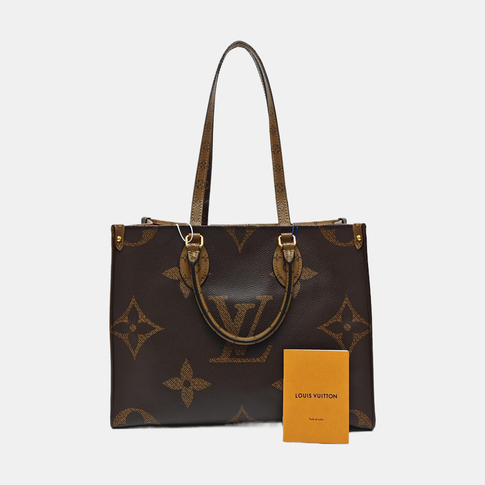 ONTHEGO MM Monogram Coated Canvas Brown