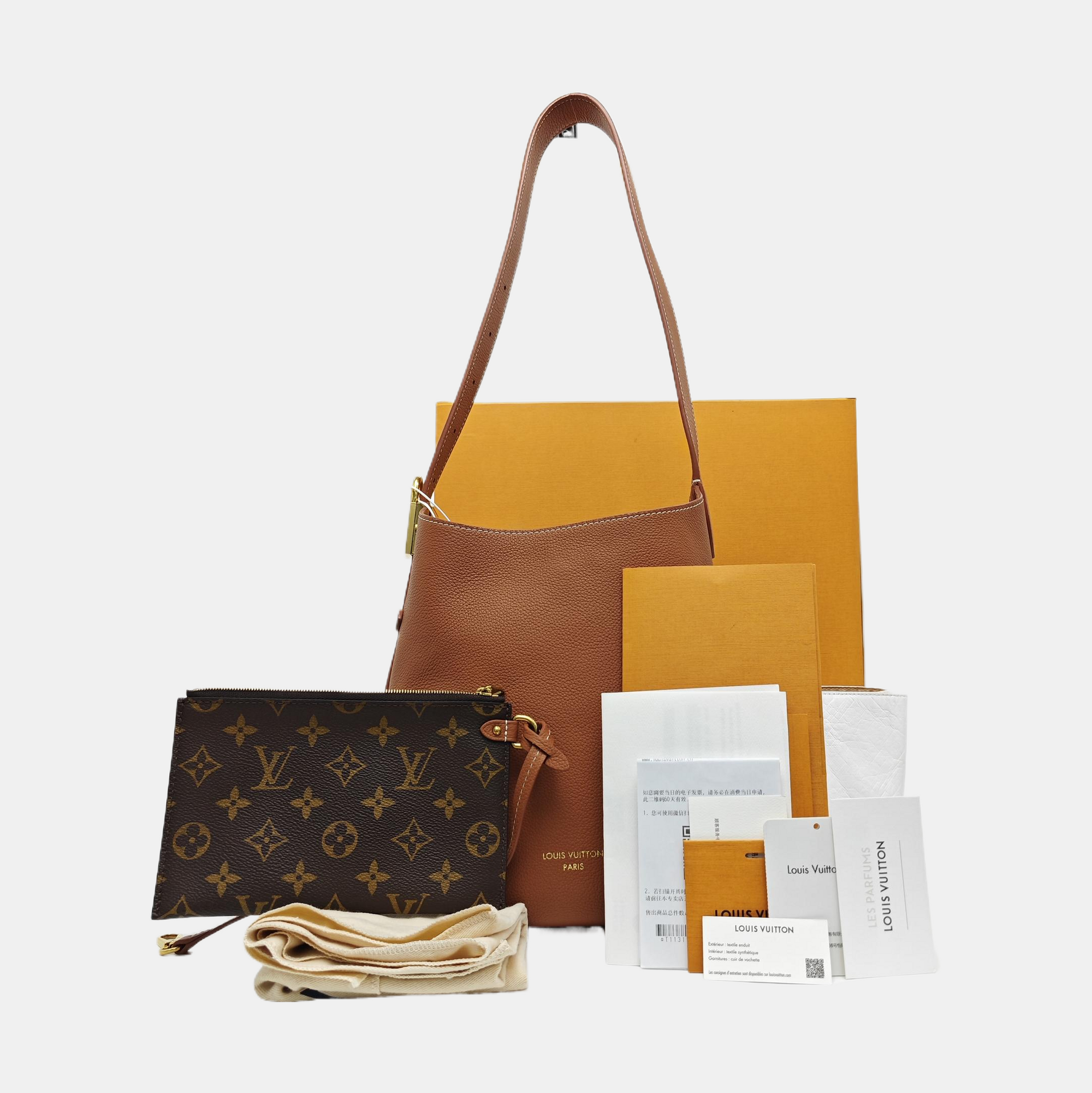 LOW KEY HOBO PM Monogram Calfskin Brown