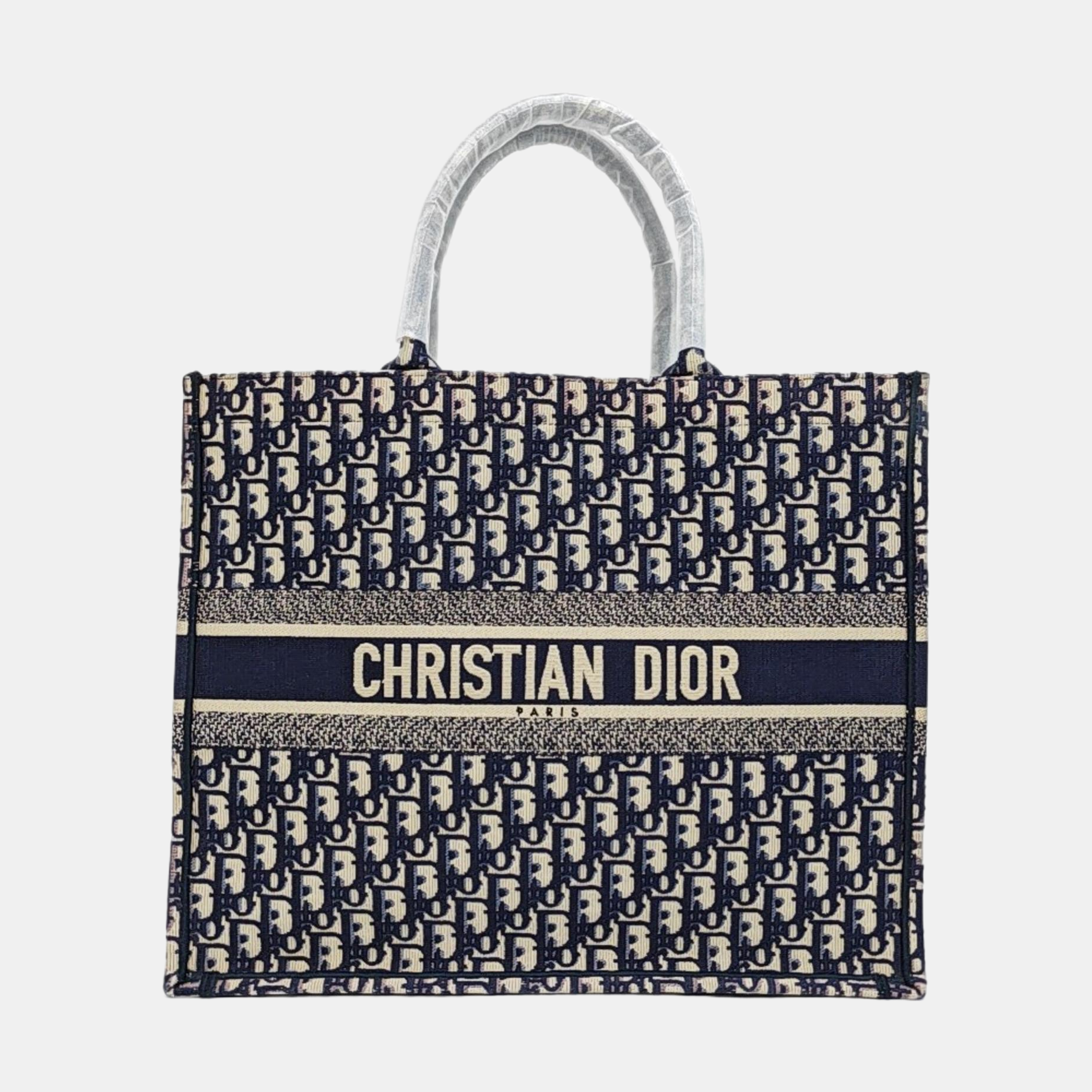 Authenticated pre-owned  Book Tote Large Monogram Canvas Beige - Tote Bag at Looply