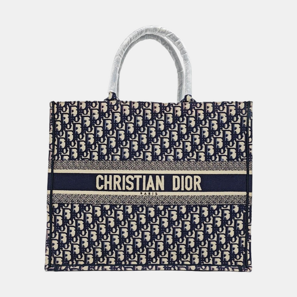 Authenticated pre-owned  Book Tote Large Monogram Canvas Beige - Tote Bag at Looply