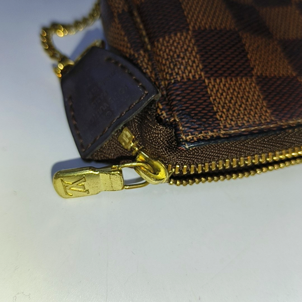 Authenticated pre-owned  ACCESSOIRES Mini Damier Ebene Coated Canvas Brown - Top Handle Bag at Looply