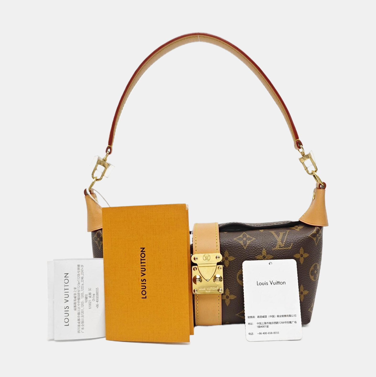 Pochette Mia Monogram Coated Canvas Brown