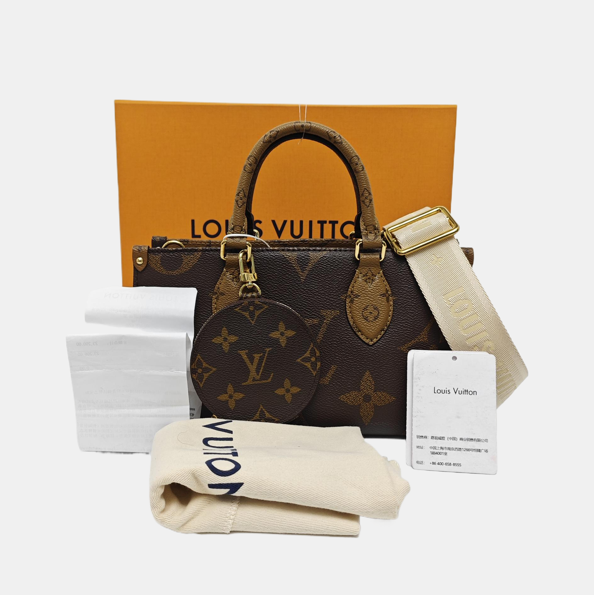 ONTHEGO EAST WEST PM Monogram Coated Canvas Brown
