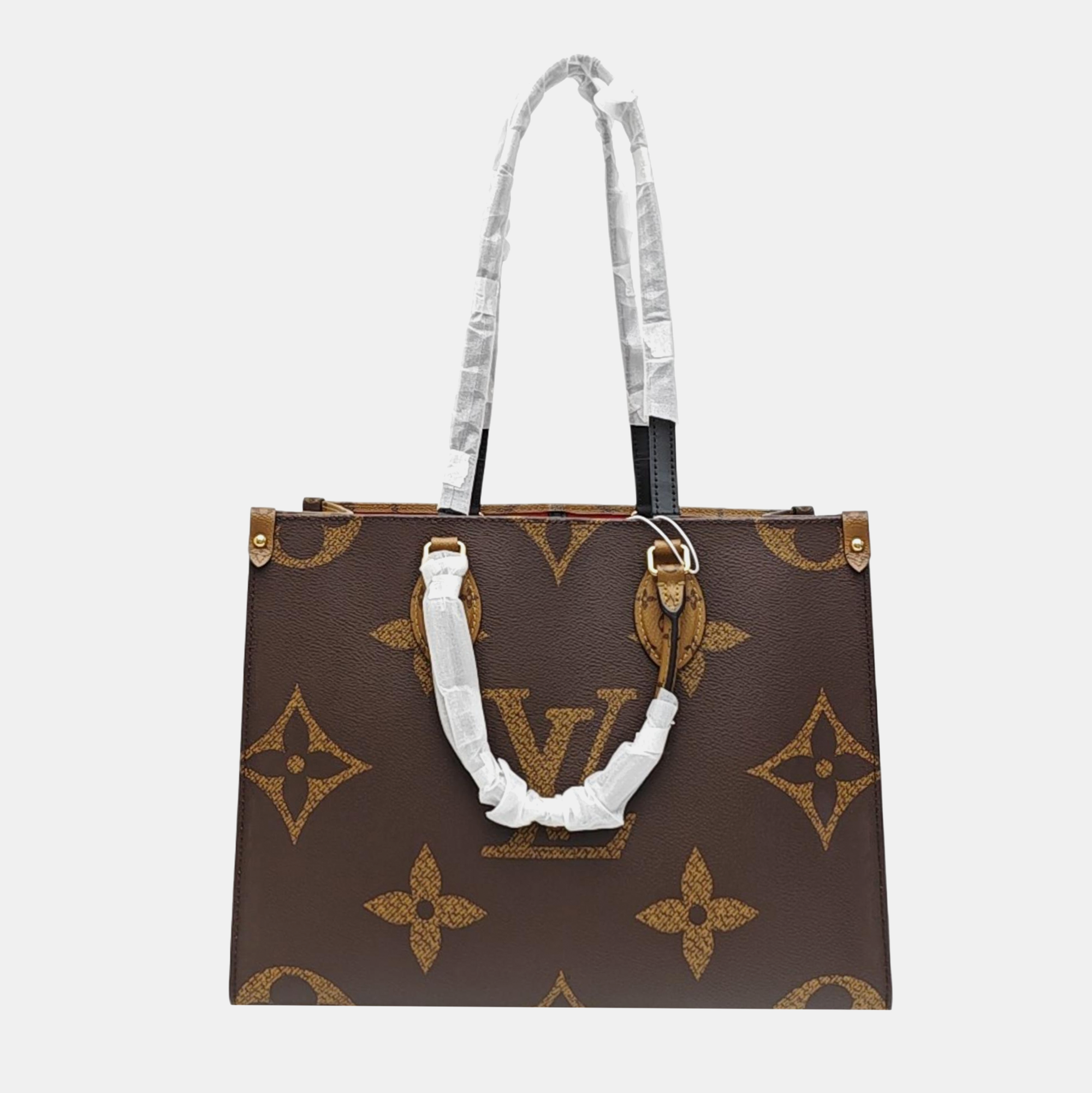 ONTHEGO MM Monogram Coated Canvas Brown