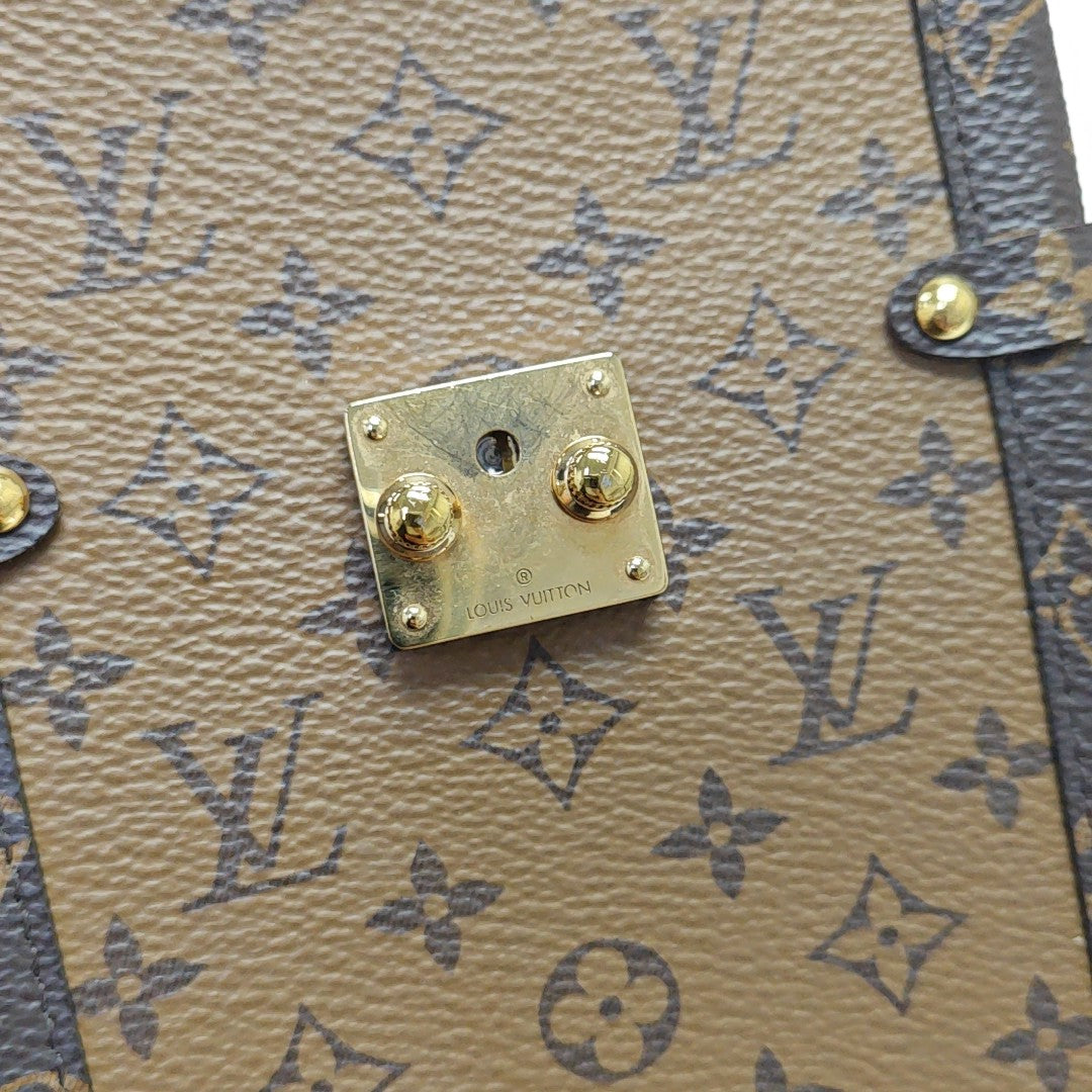 TRUNK Monogram Coated Canvas Brown
