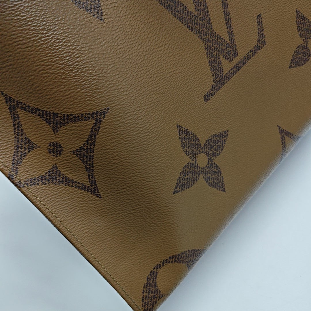 ONTHEGO MM Monogram Coated Canvas Brown