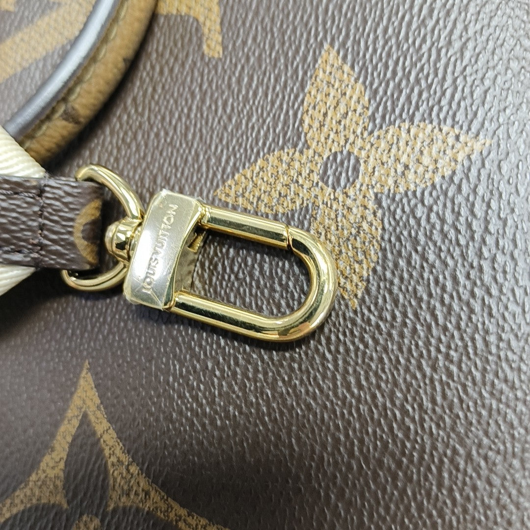 ONTHEGO PM Monogram Coated Canvas Brown