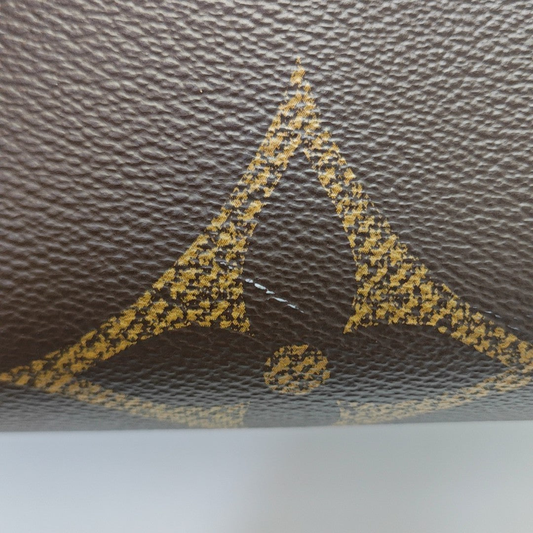ONTHEGO MM Monogram Coated Canvas Brown