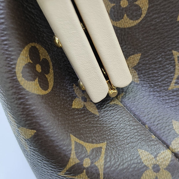 CLUTCH Monogram Coated Canvas Brown