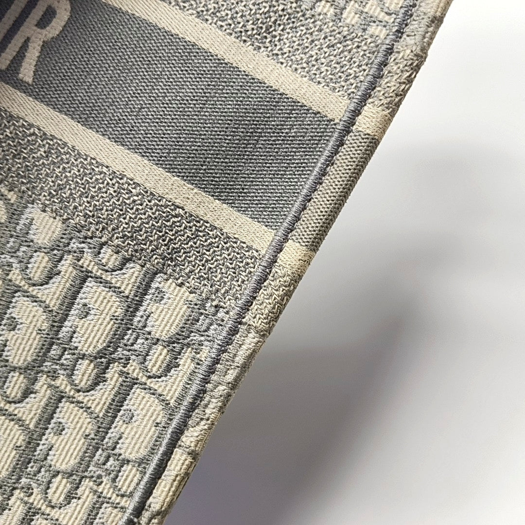 Authenticated pre-owned  Book Tote Large Monogram Canvas Grey - Tote Bag at Looply