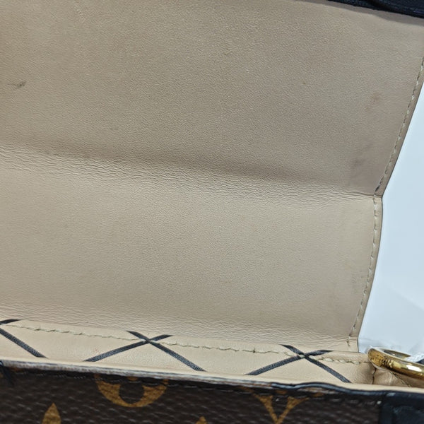 TRUNK Monogram Coated Canvas Brown