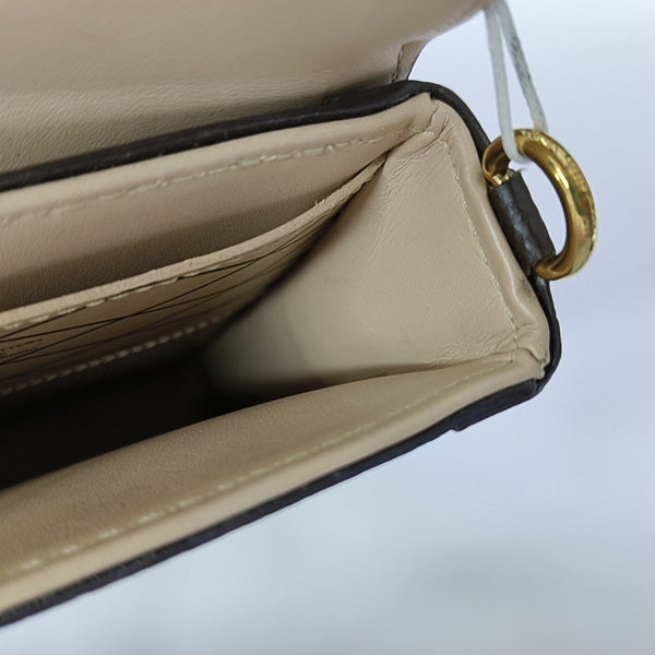 TRUNK Monogram Coated Canvas Brown