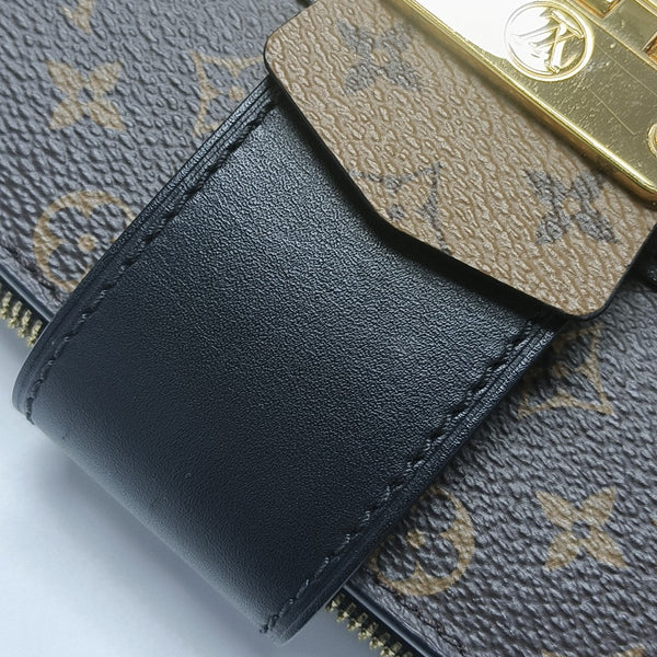 TRUNK Monogram Coated Canvas Brown
