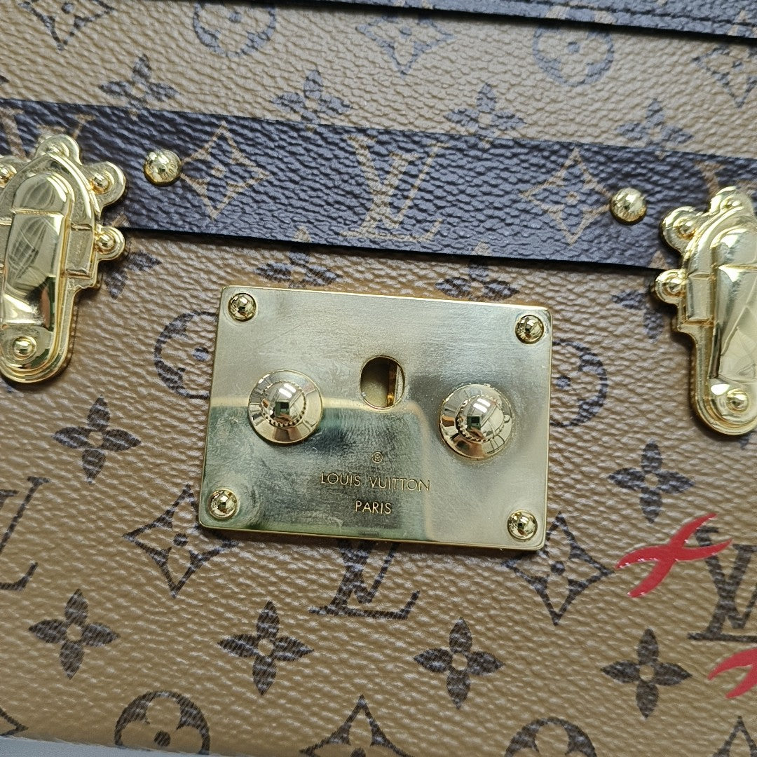 PETITE MALLE Monogram Coated Canvas Brown