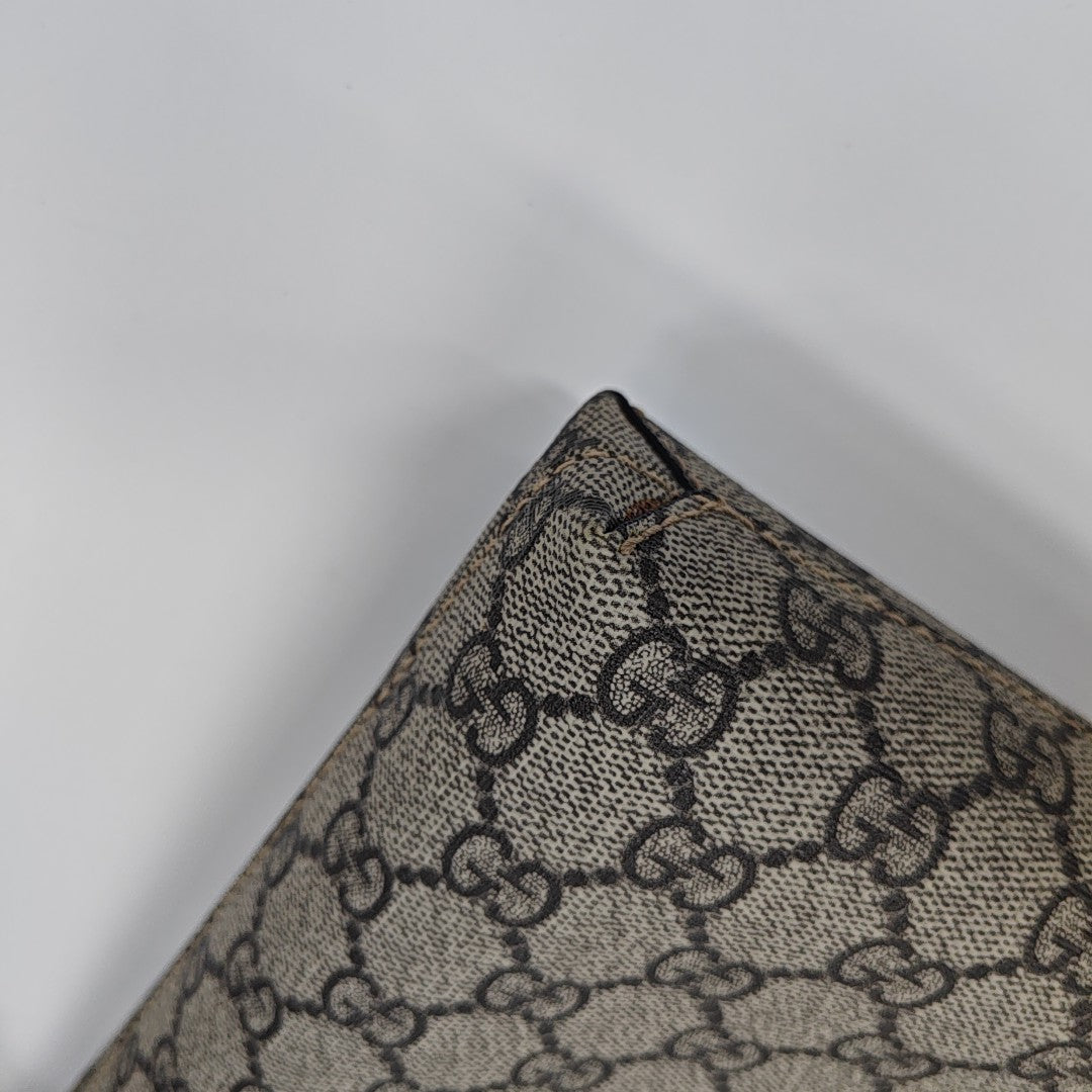 Monogram Coated Canvas Clutch Brown