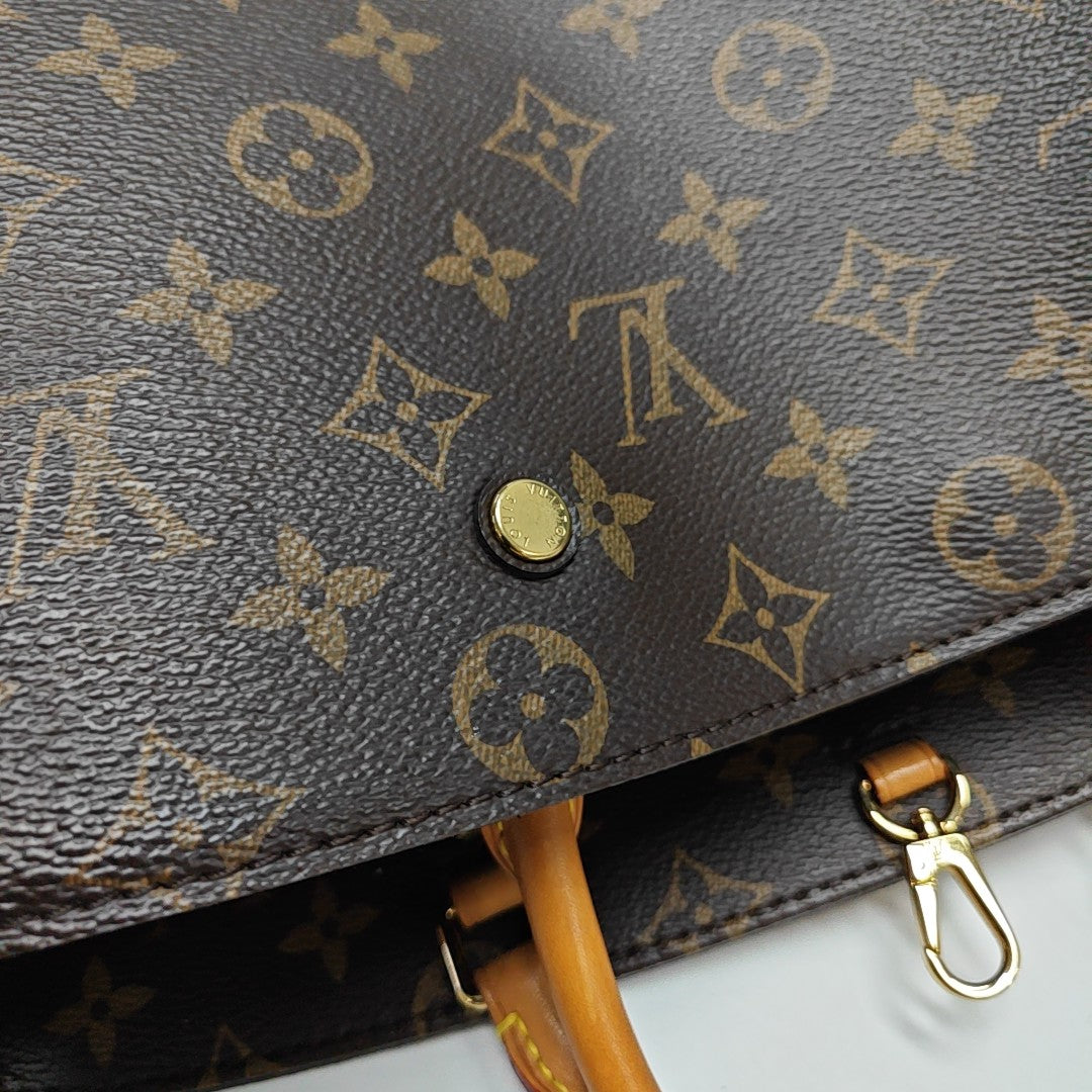 MONTAIGNE GM Monogram Coated Canvas Brown