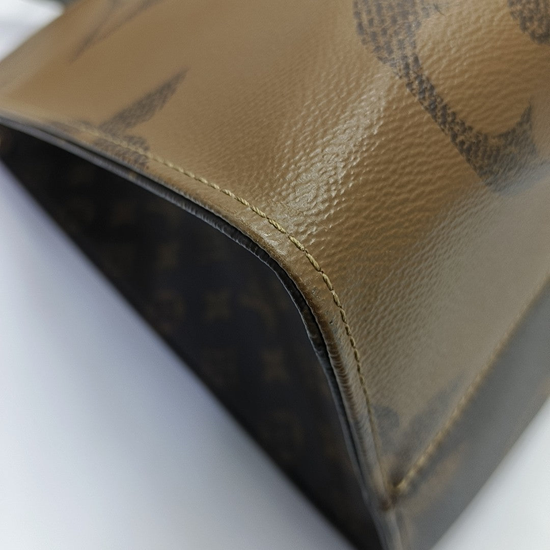 ONTHEGO GM Monogram Coated Canvas Brown