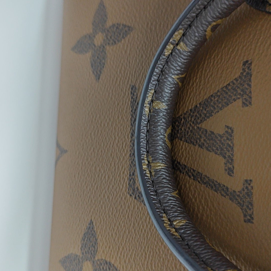ONTHEGO PM Monogram Coated Canvas Brown