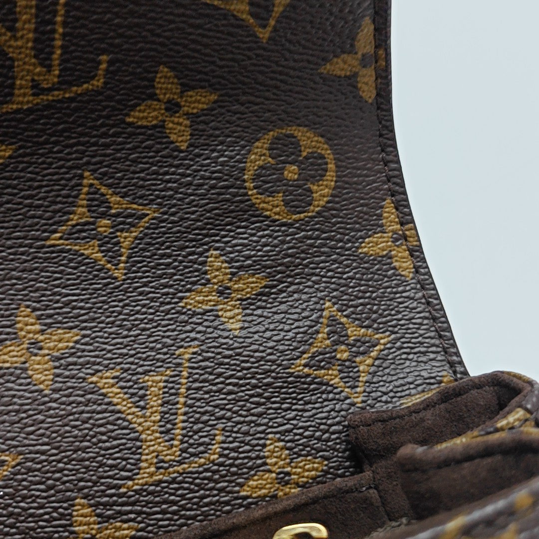 MÉTIS EAST WEST Monogram Coated Canvas Brown