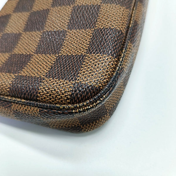 Authenticated pre-owned  ACCESSOIRES MM Damier Ebene Coated Canvas Brown - Clutch at Looply