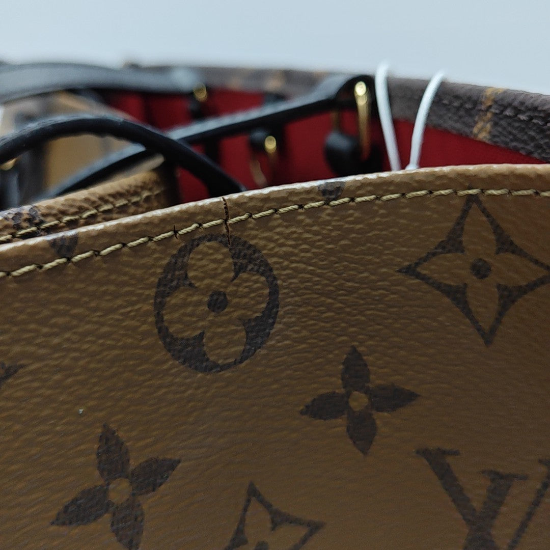 ONTHEGO MM Monogram Coated Canvas Brown