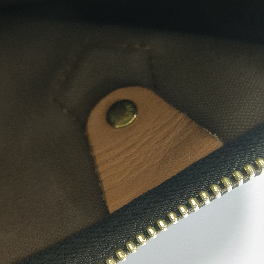 SPEEDY 25 Monogram Coated Canvas Brown