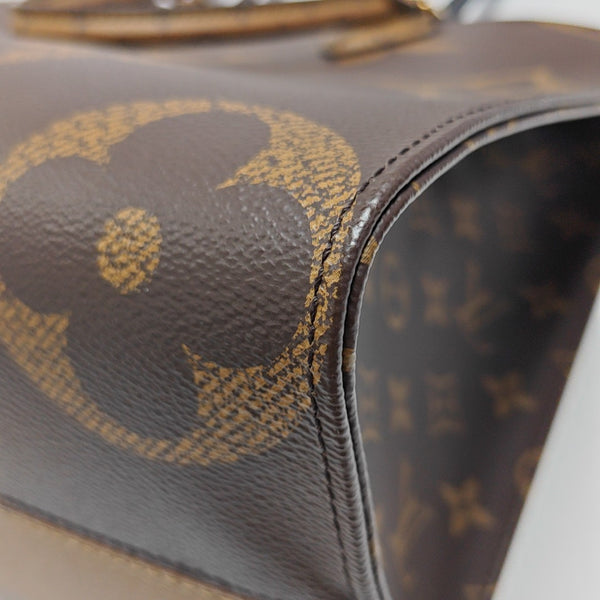ONTHEGO MM Monogram Coated Canvas Brown