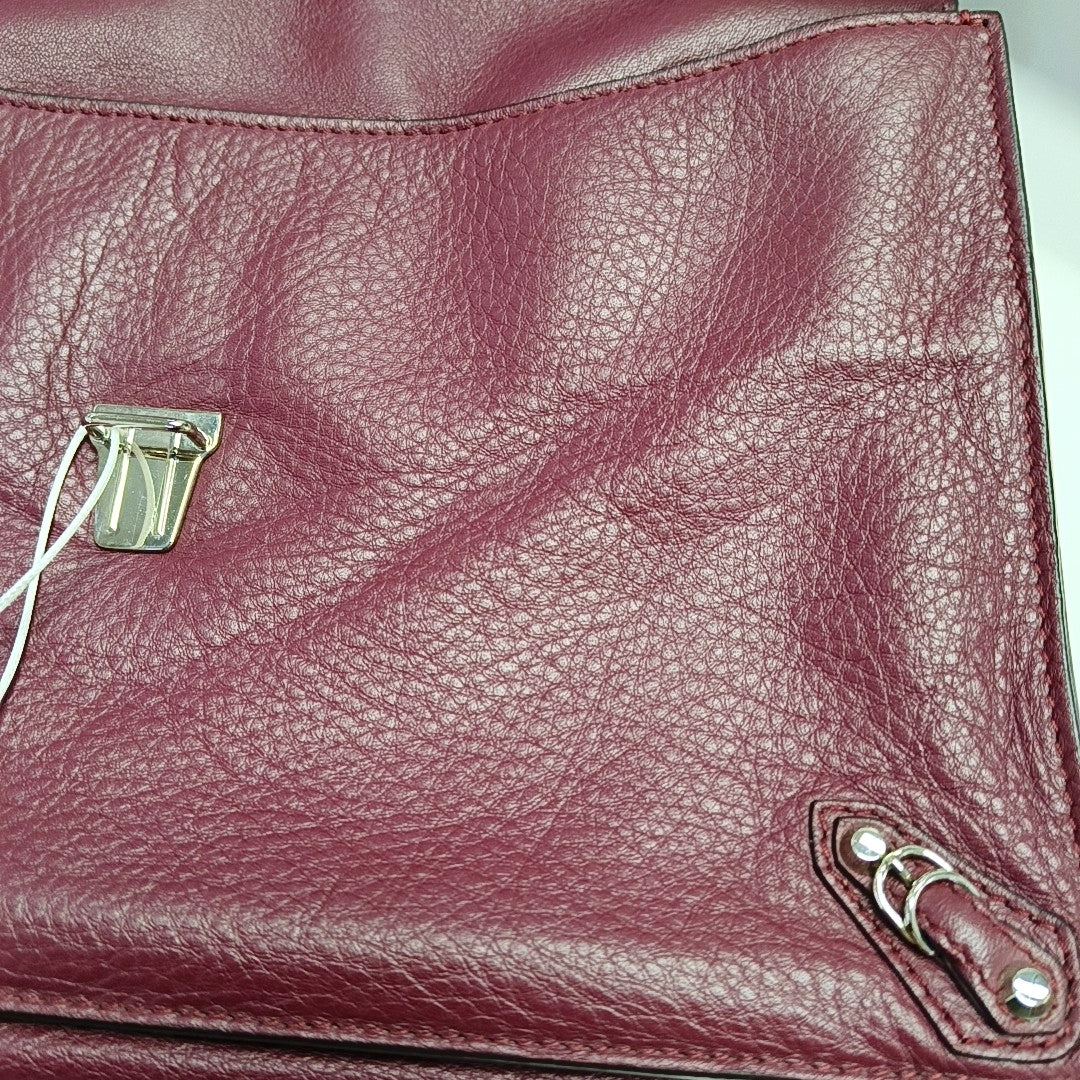 Authenticated pre-owned  Papier Calfskin Burgundy - Clutch at Looply