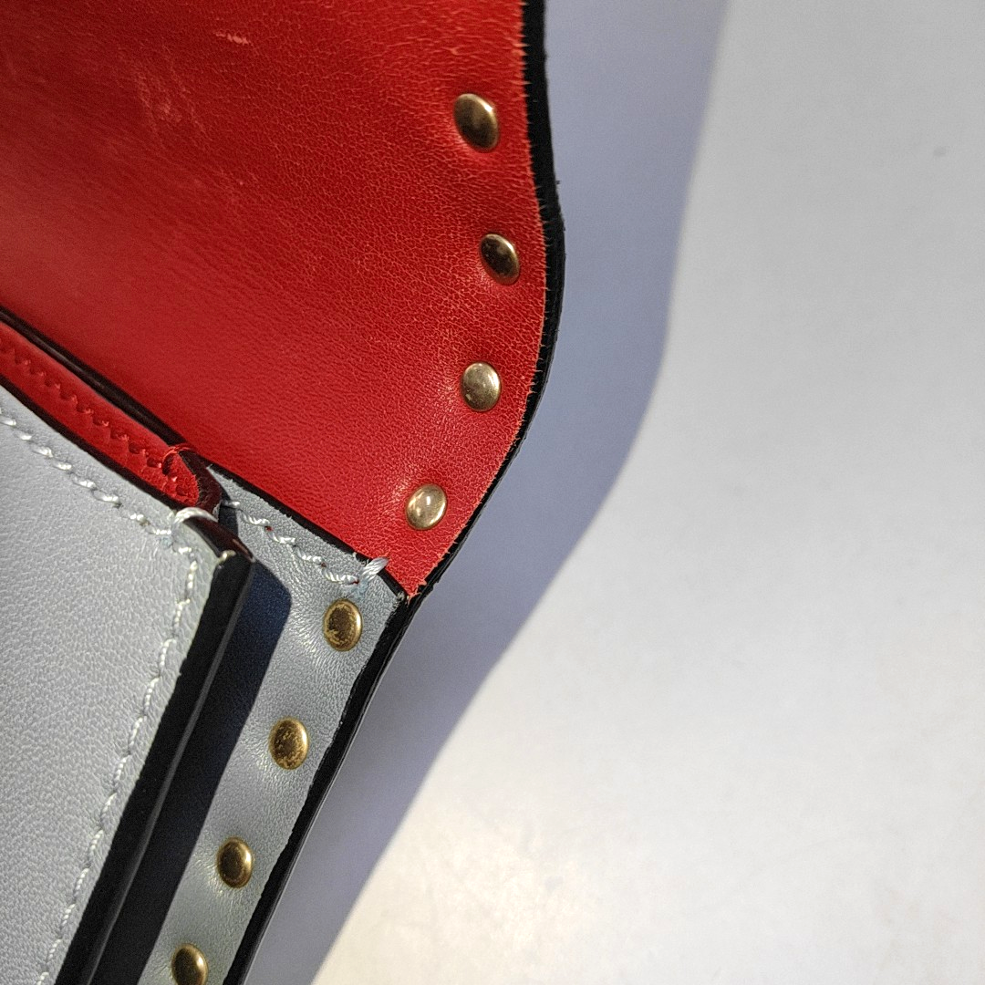Authenticated pre-owned  Rockstud Calfskin Blue - Clutch at Looply