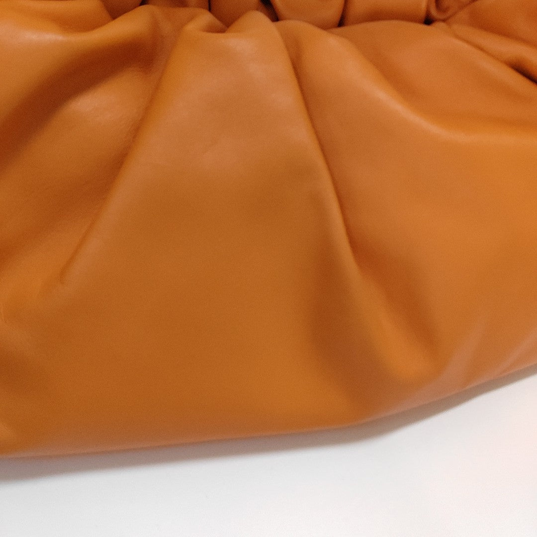 Authenticated pre-owned  The Pouch Calfskin Orange - Top Handle Bag at Looply