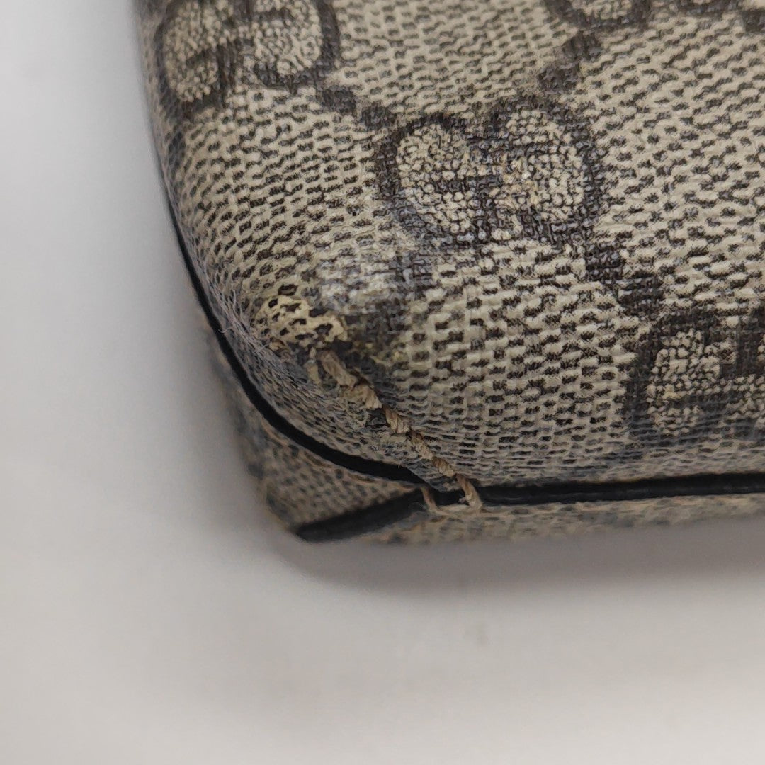 Monogram Coated Canvas Clutch Brown
