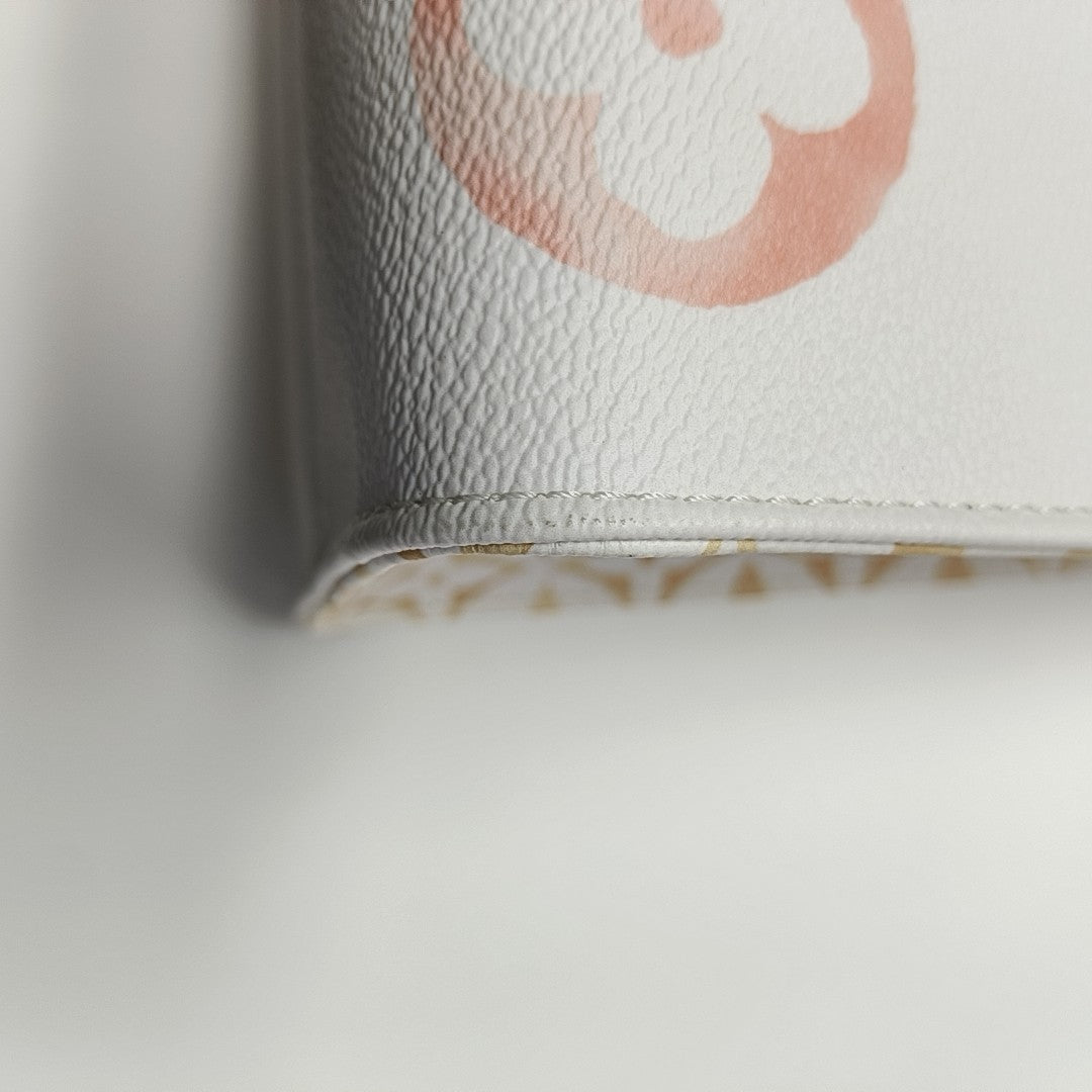ONTHEGO MM Monogram Coated Canvas White
